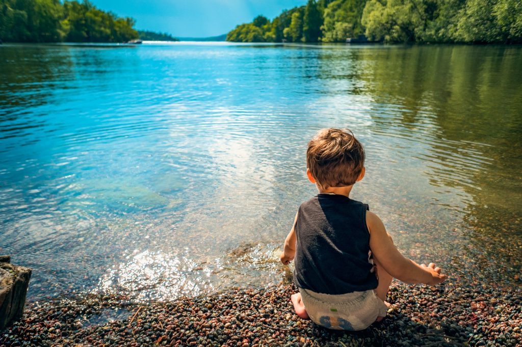 Child by water