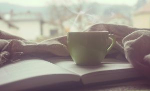 Cup of coffee and book